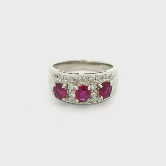 A Platinum Ring with three prong set oval cut natural Rubies in the center with adiamonds all around them at Forever Rox Fine Jewelry, Lake Tahoes Best Jewelry Store