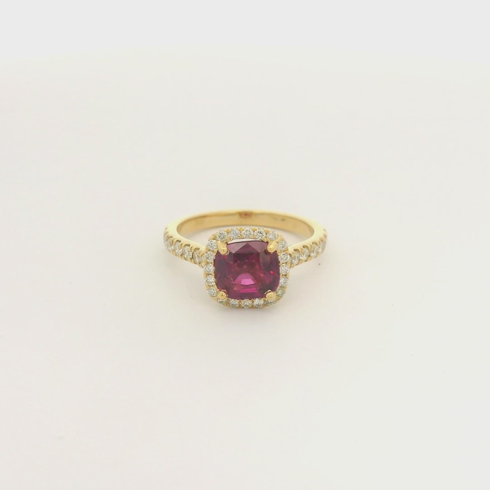 A Yellow Gold Ring with a prong set cushion cut certified TGC no heat natural Ruby in the center with a diamond bezel and down shank at Forever Rox Fine Jewelry, Lake Tahoes Best Jewelry Store