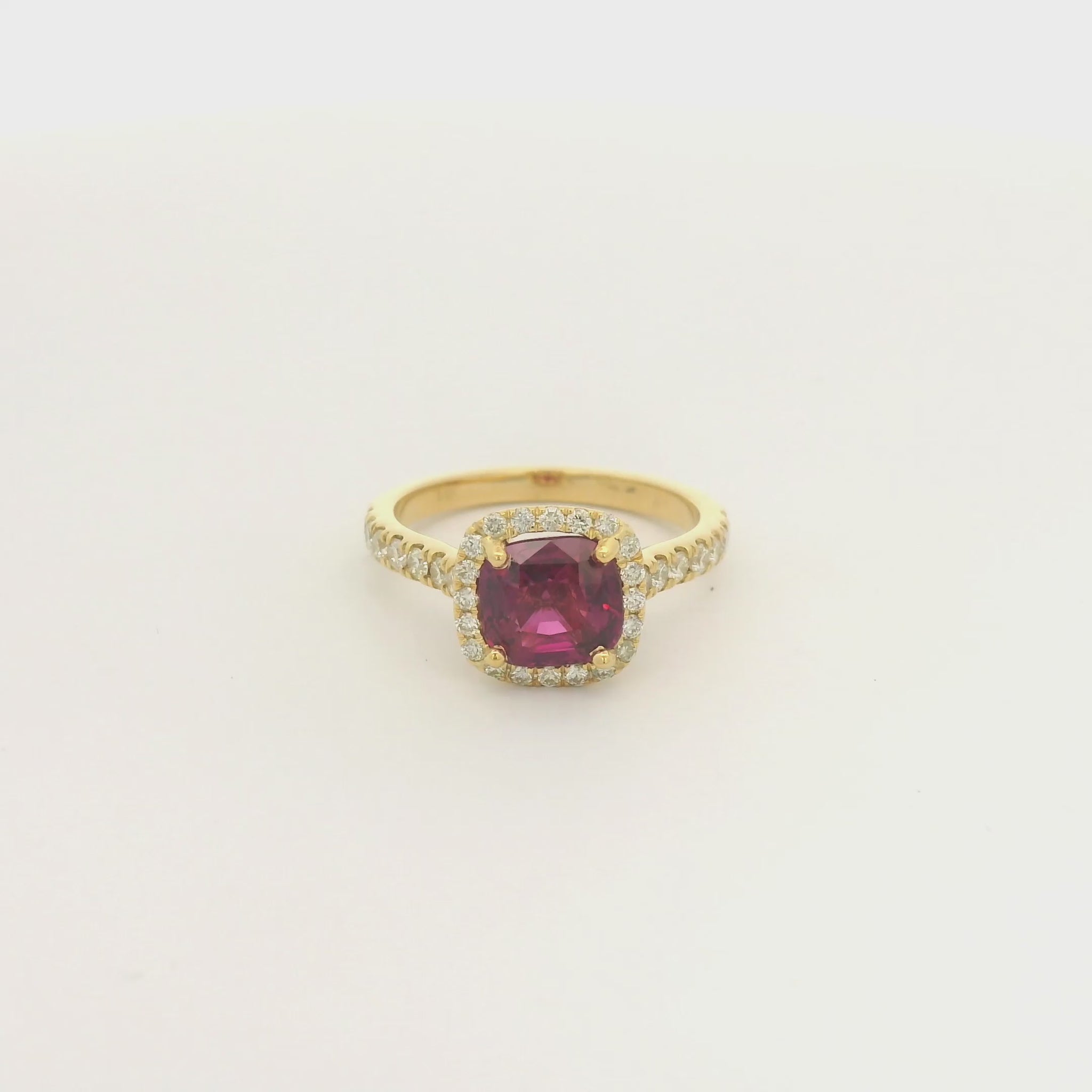 A Yellow Gold Ring with a prong set cushion cut certified TGC no heat natural Ruby in the center with a diamond bezel and down shank at Forever Rox Fine Jewelry, Lake Tahoes Best Jewelry Store