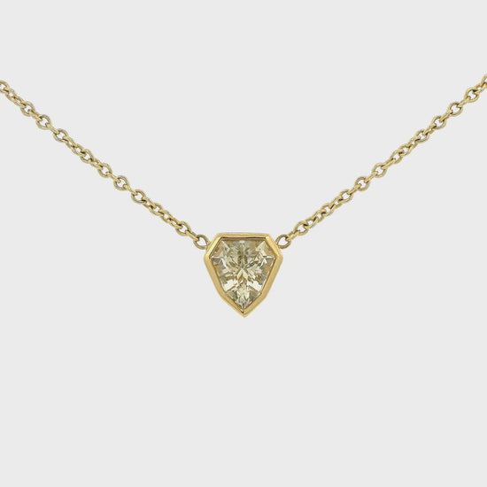A Yellow Gold Pendant with a bezel set white fancy cut Sapphire in the center with a chain attached at Lake Tahoes best Jewelry Store, Forever Rox Fine Jewelry