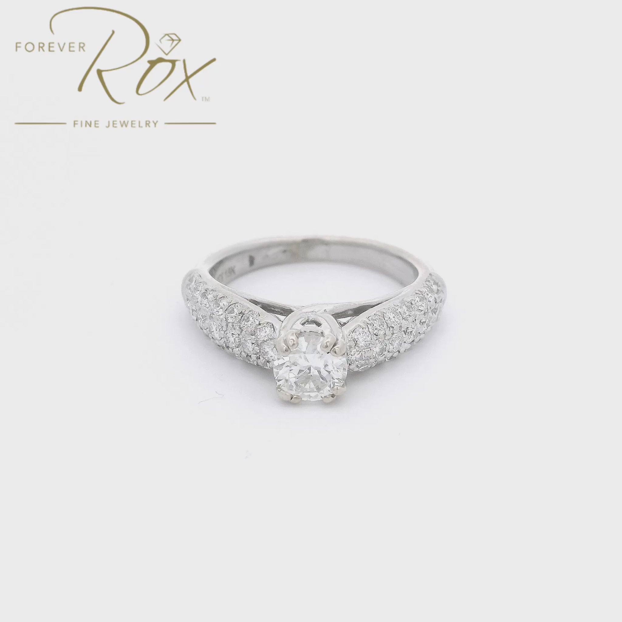 A White Gold Bridal Wedding Ring with a prong set European cut Diamond in the center with pavé set Diamonds covering the shank at Forever Rox Fine Jewelry, Lake Tahoes Best Jewelry Store