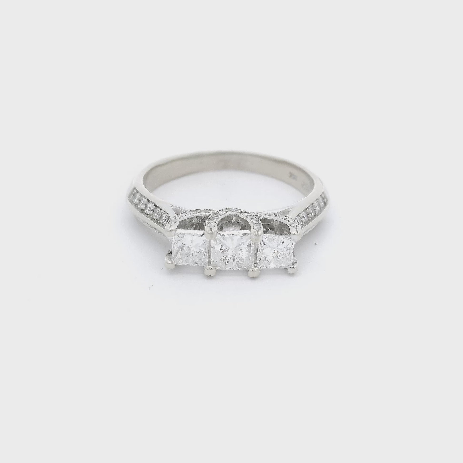 Three Princess cut diamonds and round diamonds set in a white gold ring at Forever Rox Fine Jewelry