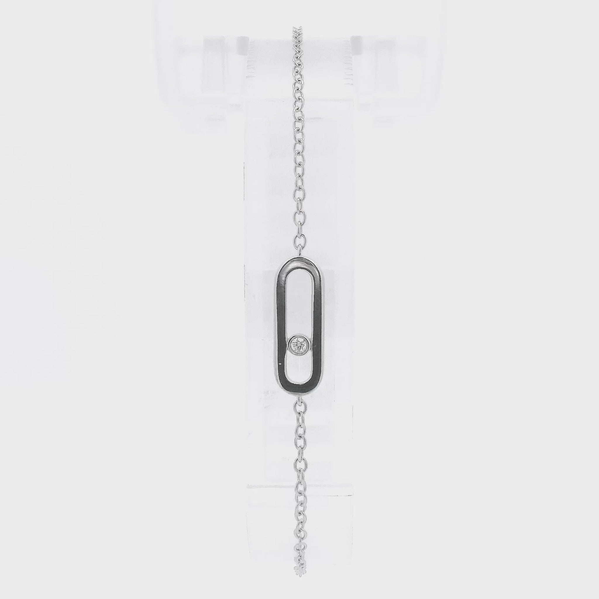 A White Gold Chain Bracelet with a oval in the senter and a single round cut natural Diamond offset in the center at Forever Rox Fine Jewelry, Lake Tahoes Best Jewelry Store
