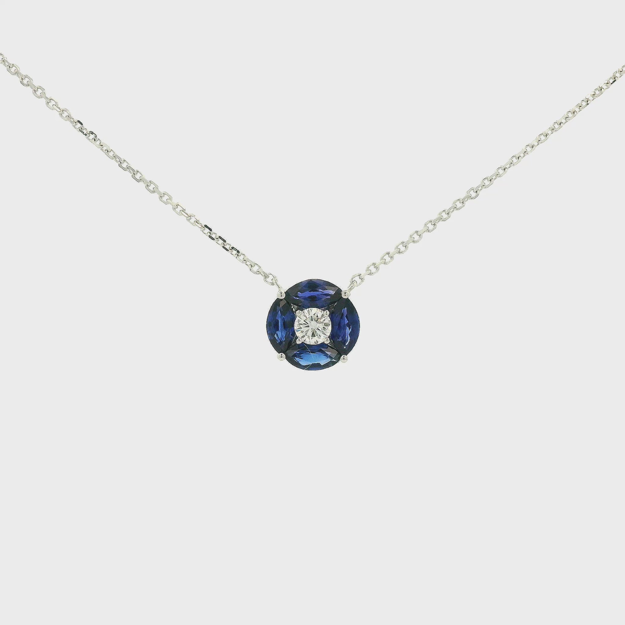 A White Gold Pendant with a round cut diamond in the center & 4 marquise cut Sapphires in a circle around it at Forever Rox Fine Jewelry, Lake Tahoes Best Jewelry Store