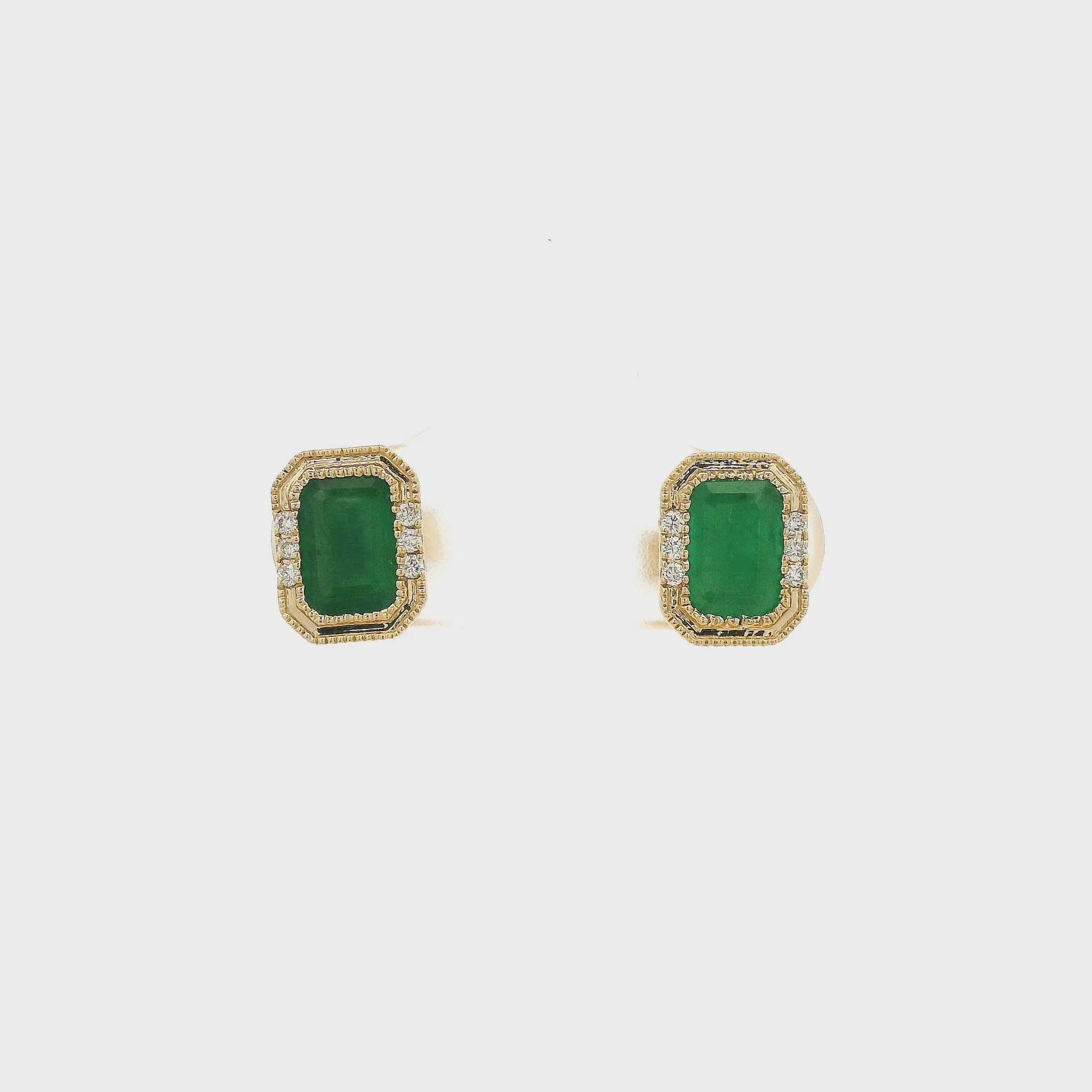 A Pair of Yellow Gold Earrings with a bezel set emerald cut natural Emerald in the center with a halo of diamonds at Forever Rox Fine Jewelry, Lake Tahoes Best Jewelry Store