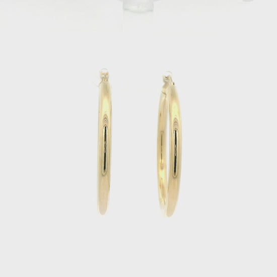 A Pair of Yellow Gold Hoops Earrings at Forever Rox Fine Jewelry, Lake Tahoes Best Jewelry Store