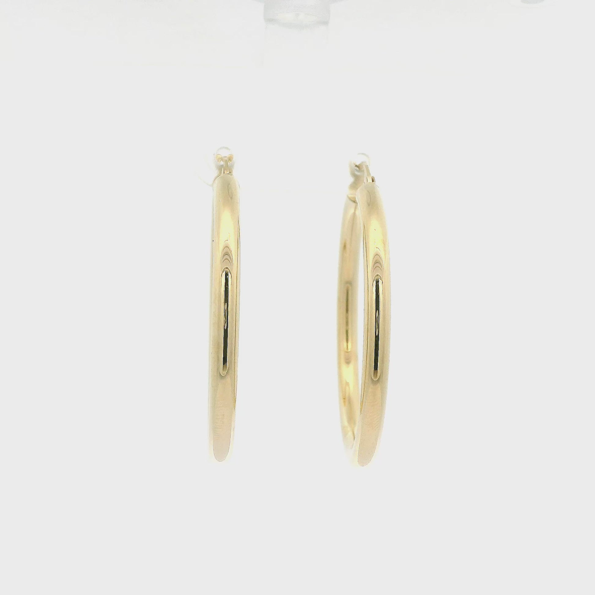A Pair of Yellow Gold Hoops Earrings at Forever Rox Fine Jewelry, Lake Tahoes Best Jewelry Store
