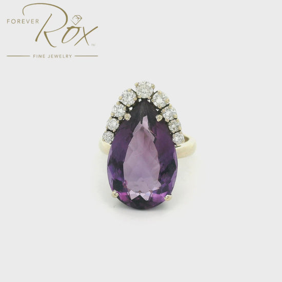 Purple pear shape Amethyst set in a white gold ring with diamonds surround teh top of the stone at Forever Rox Fine Jewelry