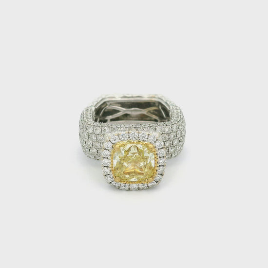 A White Gold Ring with a bezel/prong set cushion cut yellow Diamond in the center with pavé set diamonds around the ring at Forever Rox Fine Jewelry, Lake Tahoes Best Jewelry Store