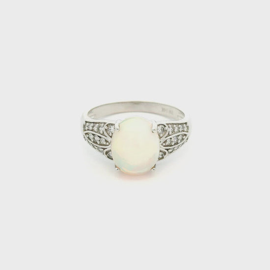 A White Gold Ring with a prong set natural Ethiopian Opal in the center withdiamonds on the shank at Forever Rox Fine Jewelry, Lake Tahoes Best Jewelry Store