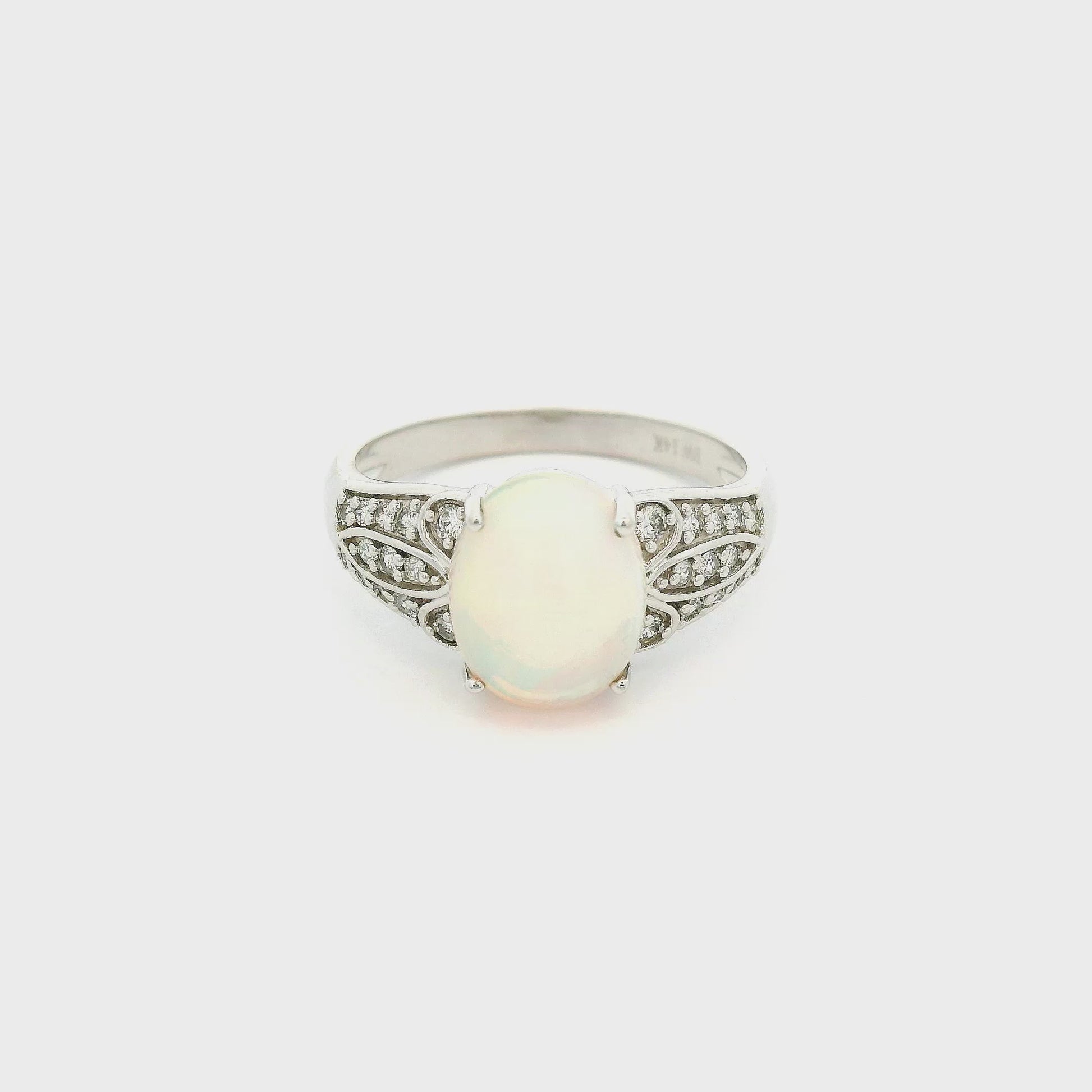 A White Gold Ring with a prong set natural Ethiopian Opal in the center withdiamonds on the shank at Forever Rox Fine Jewelry, Lake Tahoes Best Jewelry Store