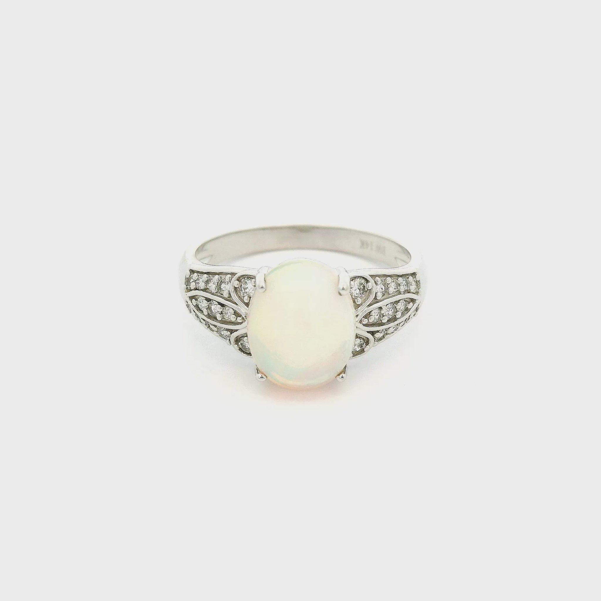 A White Gold Ring with a prong set natural Ethiopian Opal in the center withdiamonds on the shank at Forever Rox Fine Jewelry, Lake Tahoes Best Jewelry Store