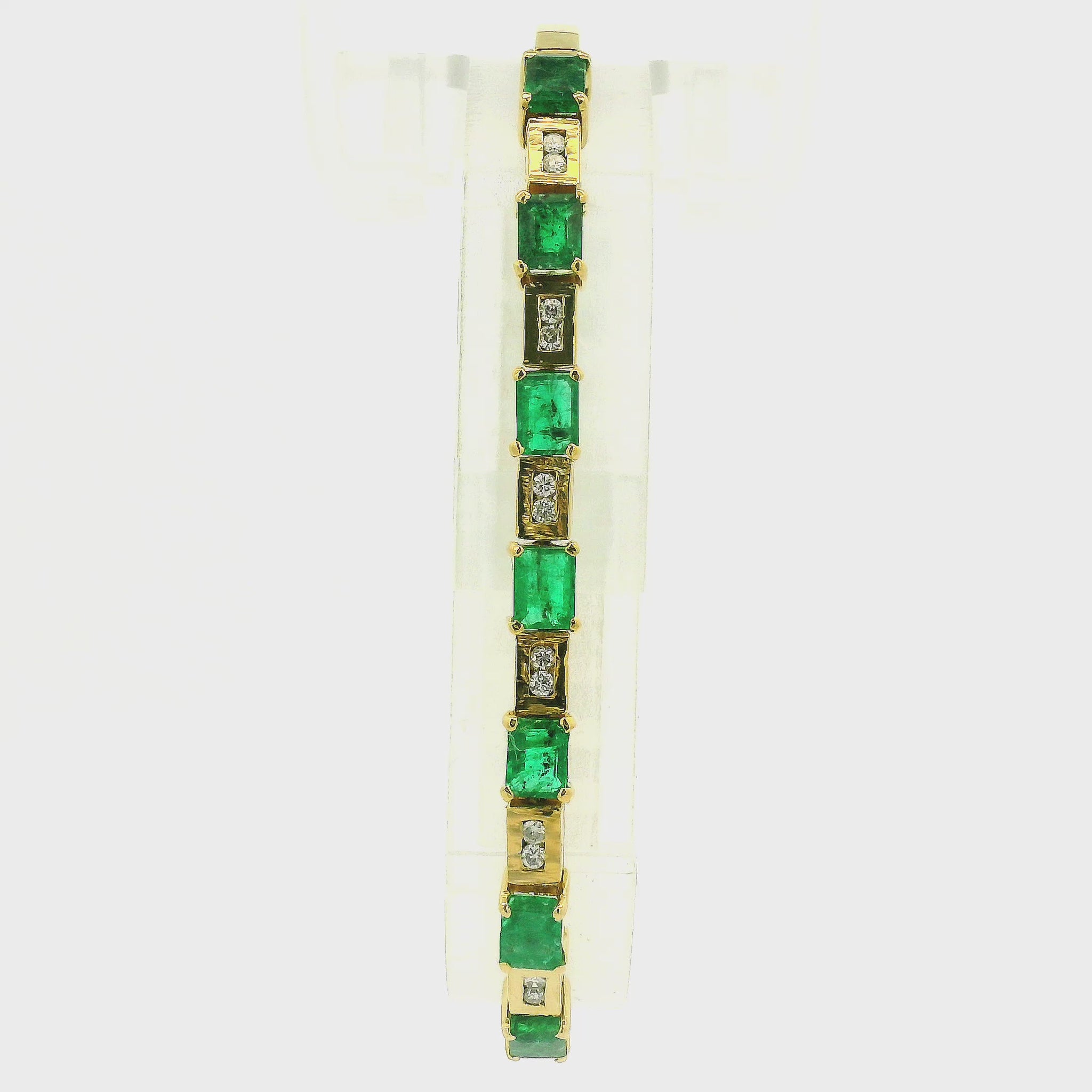 A Yellow Gold Bracelet with a prong set emerald cut natural Emeraldsand diamonds at Forever Rox Fine Jewelry, Lake Tahoes Best Jewelry Store