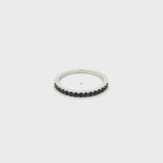 A White Gold Eternity Band with natural Dark Blue Sapphires half way around at Forever Rox Fine Jewelry, Lake Tahoes Best Jewelry Store