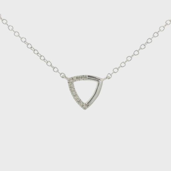 A White Gold Trianlge Shaped Pendant with Diamonds set in half of the pendant with a chain attached at Forever Rox Fine Jewelry, Lake Tahoes Best Jewelry Store
