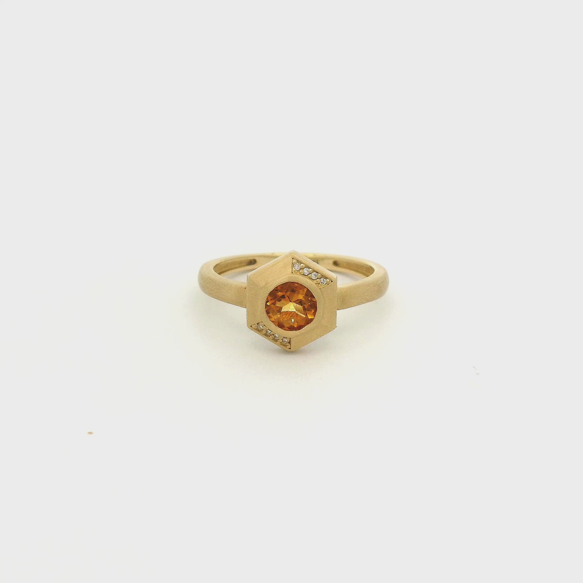 A Yellow Gold Ring with a bezel set round cut natural Citrine in the center with 8 diamonds flush set in the hexagon bezel at Forever Rox Fine Jewelry, Lake Tahoes Best Jewelry Store
