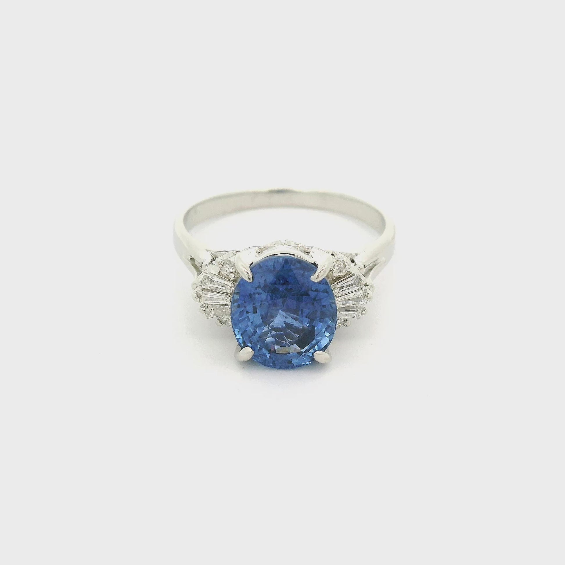 A Platinum Ring with a prong set oval cut natural Ceylon Sapphire in the center with baguette & Round Cut Diamonds at Forever Rox Fine Jewelry, Lake Tahoes Best Jewelry Store