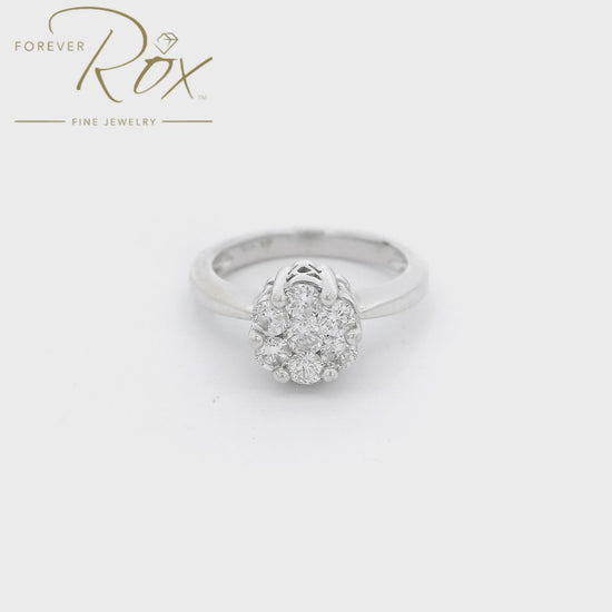 White Gold ring with 7 round cut diamonds cluster set in the center of the raised head with carved designs on the side at Forever Rox Fine Jewelry