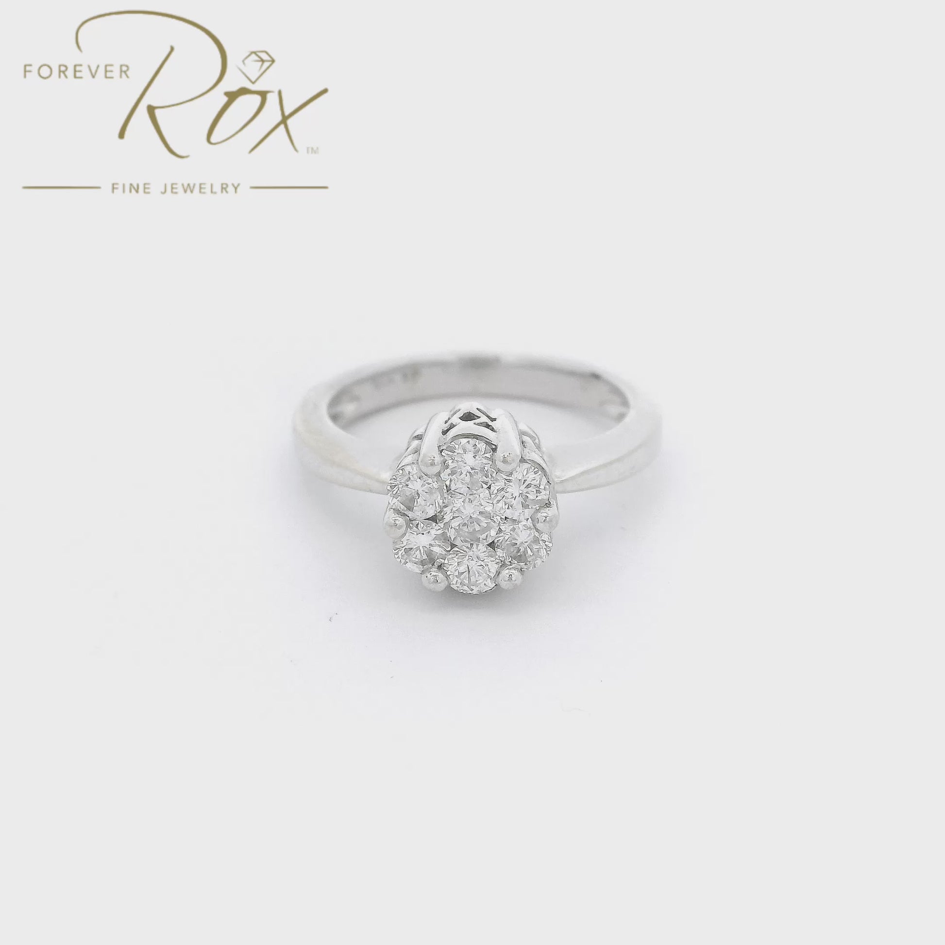 White Gold ring with 7 round cut diamonds cluster set in the center of the raised head with carved designs on the side at Forever Rox Fine Jewelry