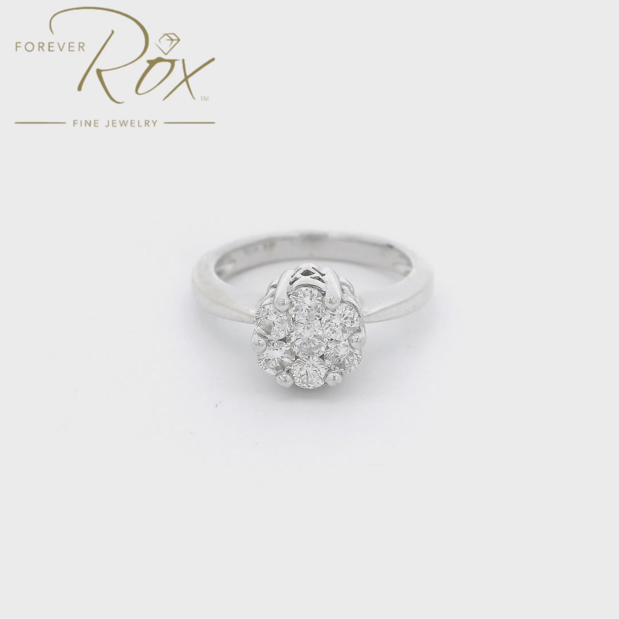 White Gold ring with 7 round cut diamonds cluster set in the center of the raised head with carved designs on the side at Forever Rox Fine Jewelry