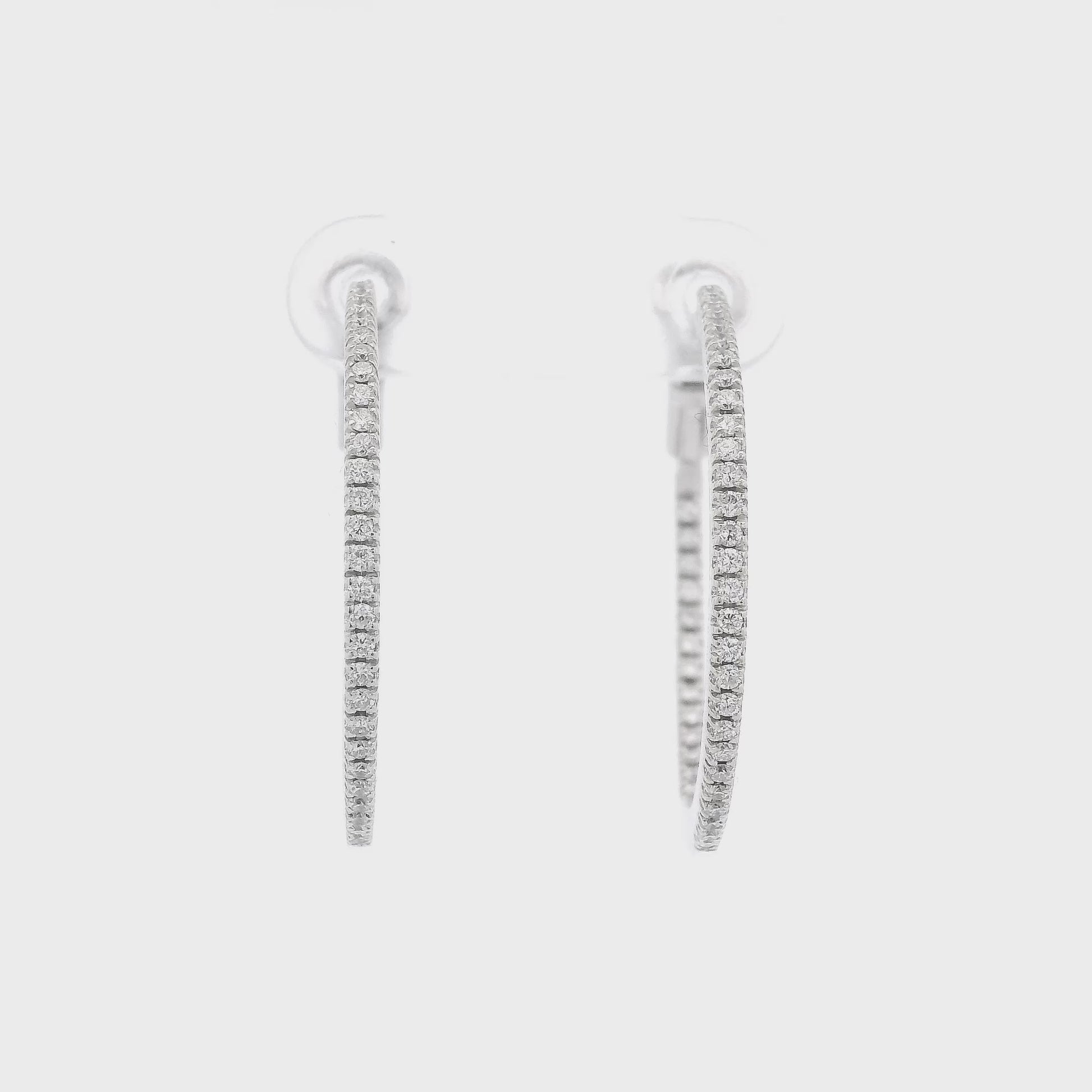 A Pair of White Gold Diamond Hoops with A Flip Lock at Forever Rox Fine Jewelry