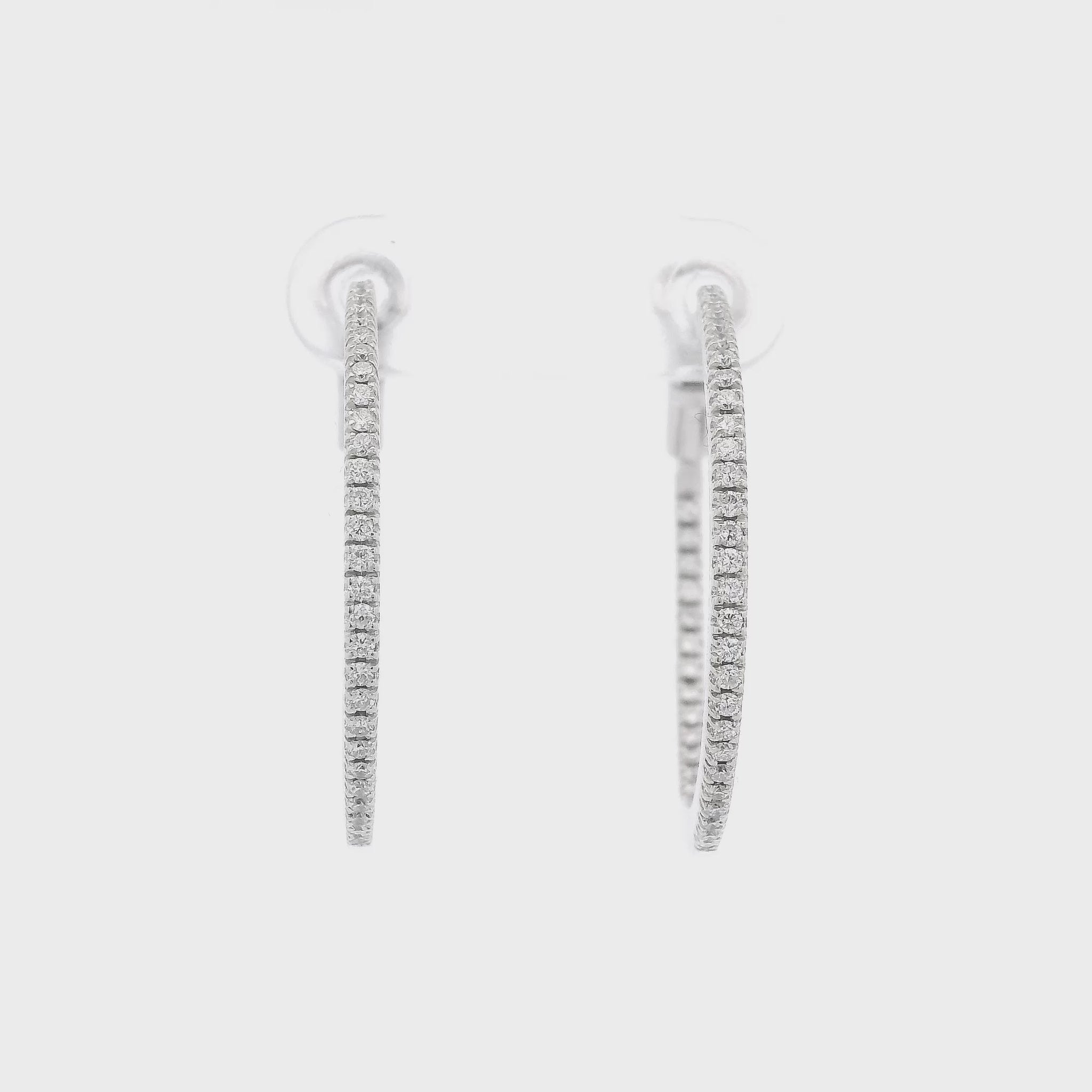 A Pair of White Gold Diamond Hoops with A Flip Lock at Forever Rox Fine Jewelry