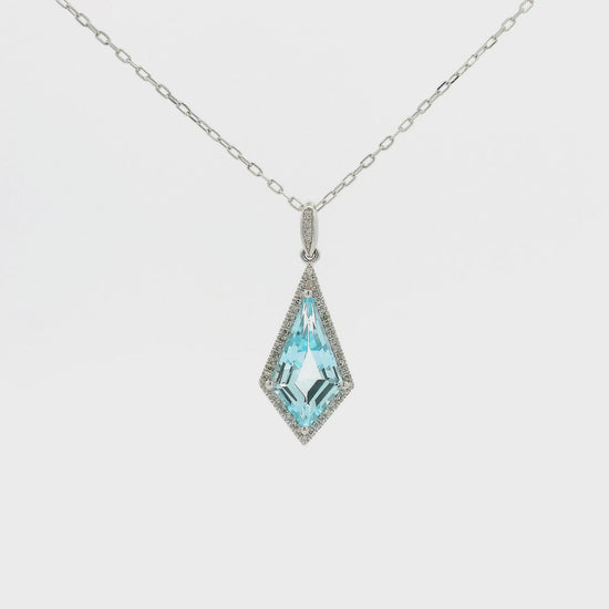 A White Gold Pendant with a prong set kite cut natural Blue Topaz in the center with a halo of Natural Diamonds at Forever Rox Fine Jewelry, Lake Tahoes Best Jewelry Store