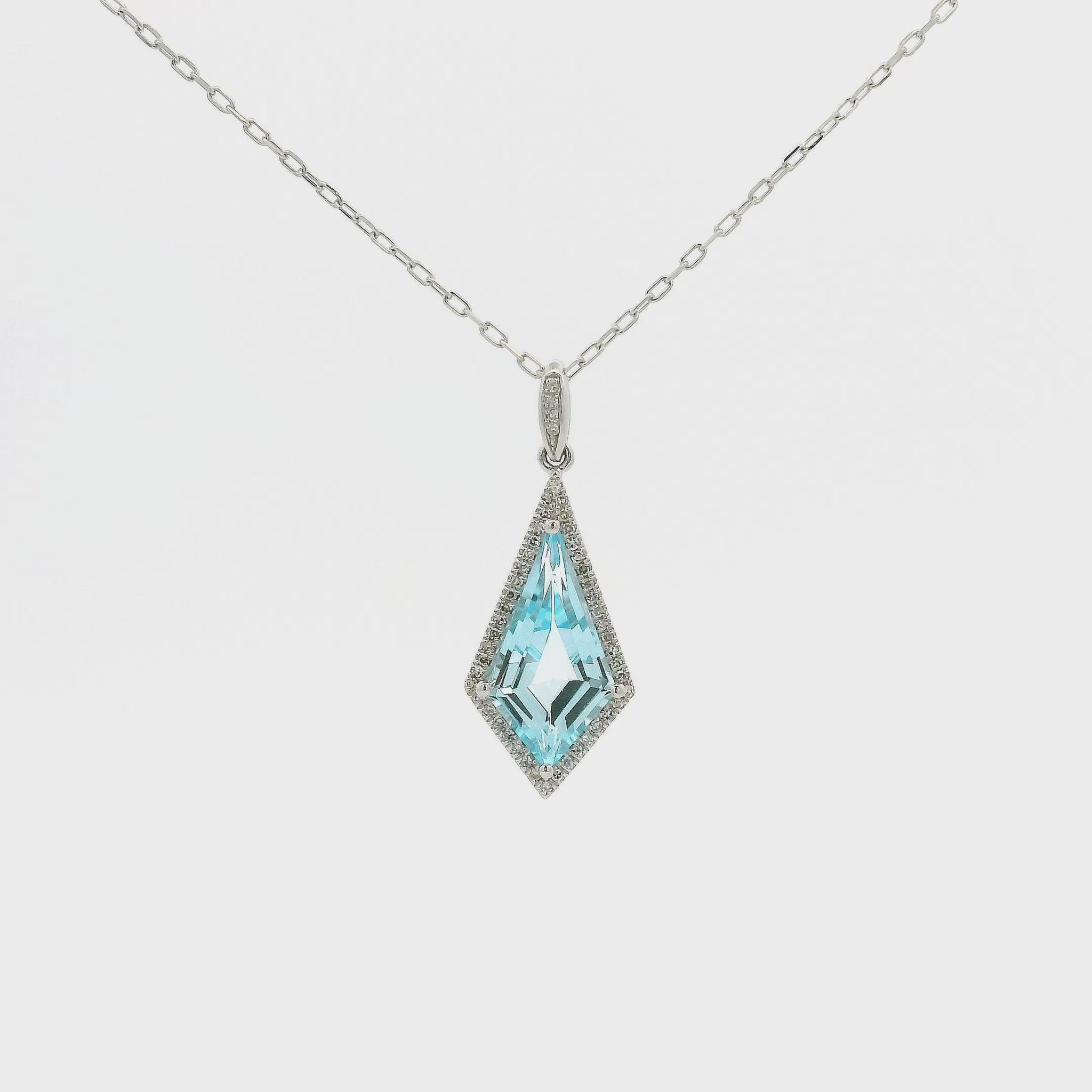 A White Gold Pendant with a prong set kite cut natural Blue Topaz in the center with a halo of Natural Diamonds at Forever Rox Fine Jewelry, Lake Tahoes Best Jewelry Store