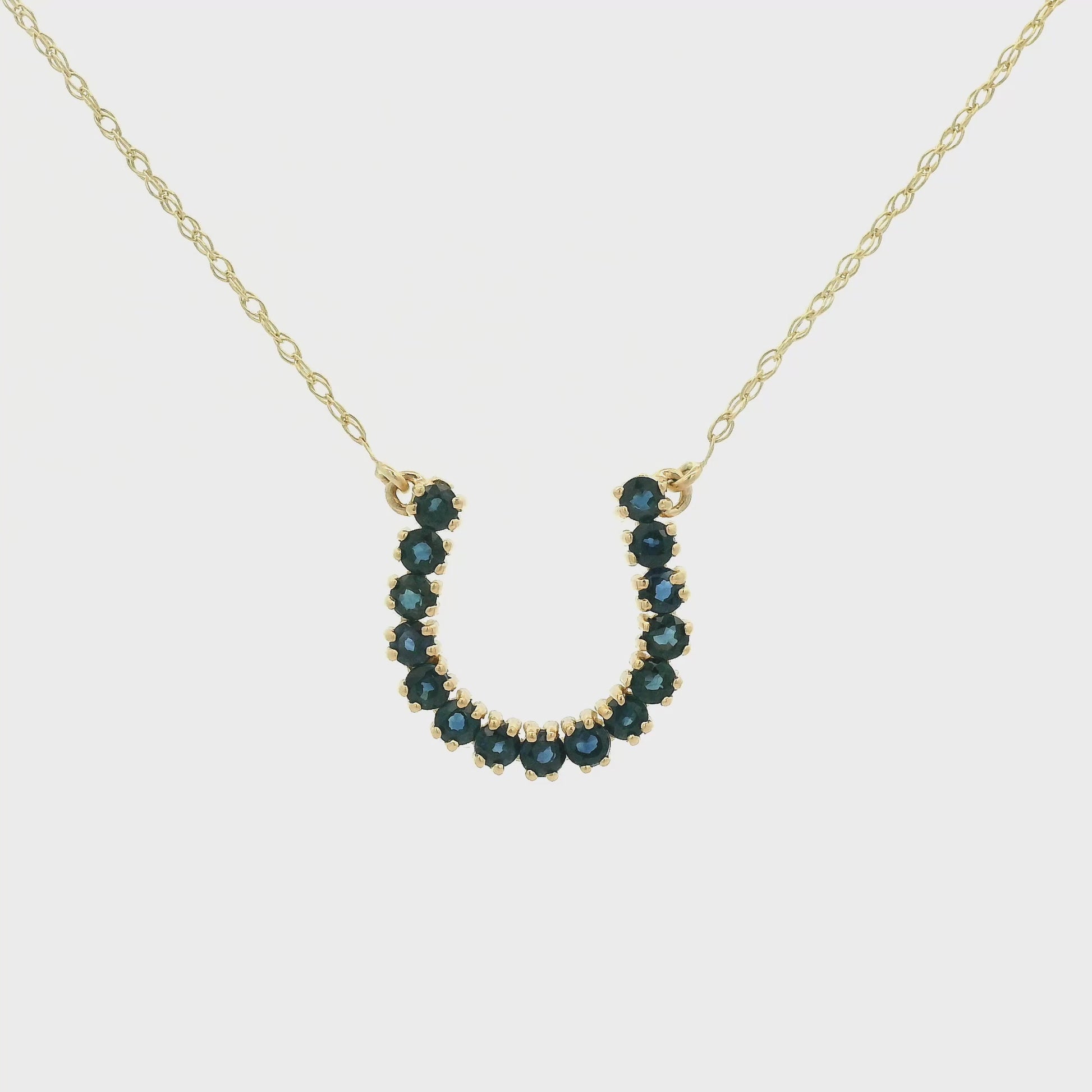 Yellow Gold Horseshoe Pendant with natural Sapphires or Natural Emeralds at Forever Rox Fine Jewelry, Lake Tahoes Best Jewelry Store