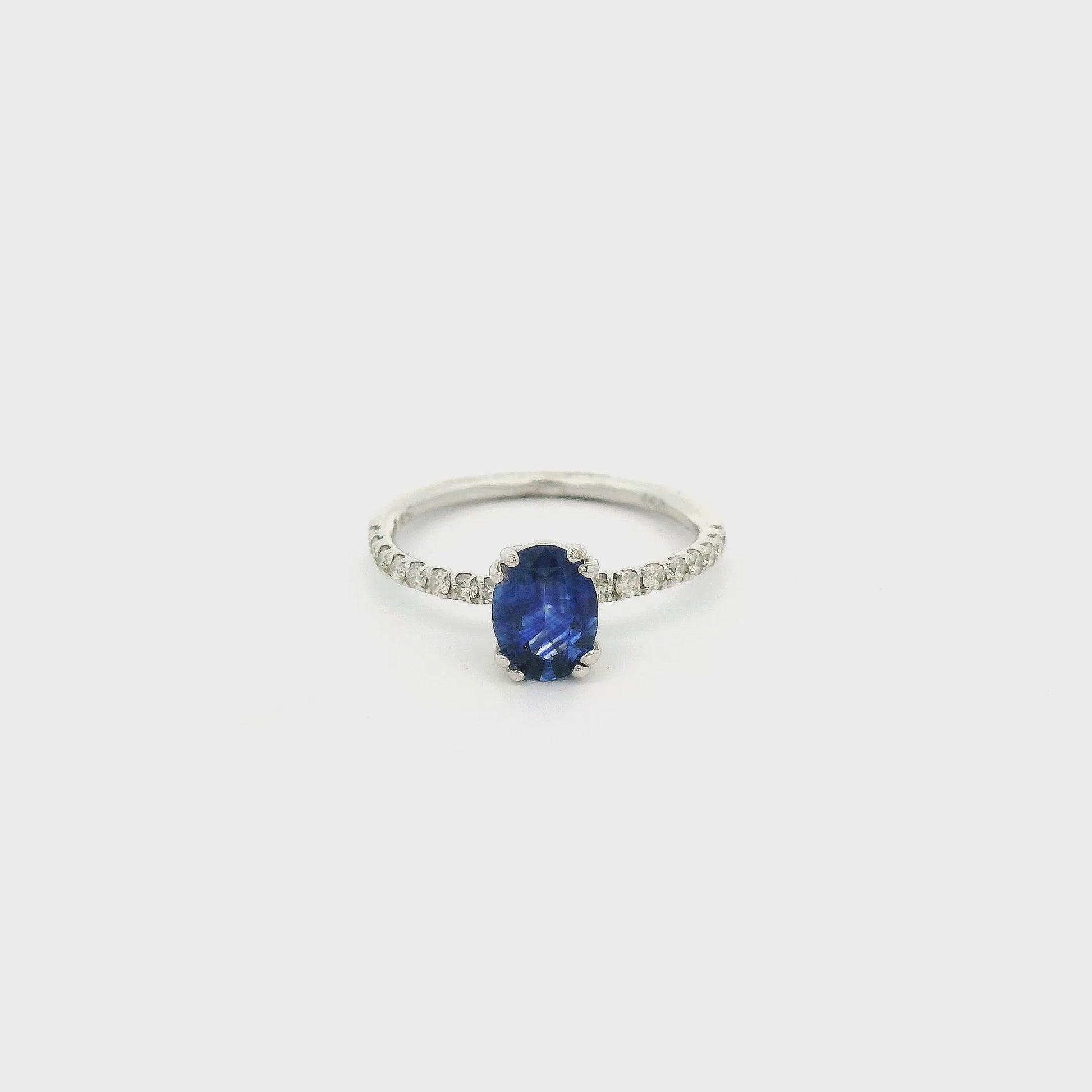 A White Gold Ring with a prong set oval cut natural Sapphire in the center with down the shank at Forever Rox Fine Jewelry, Lake Tahoes Best Jewelry Store
