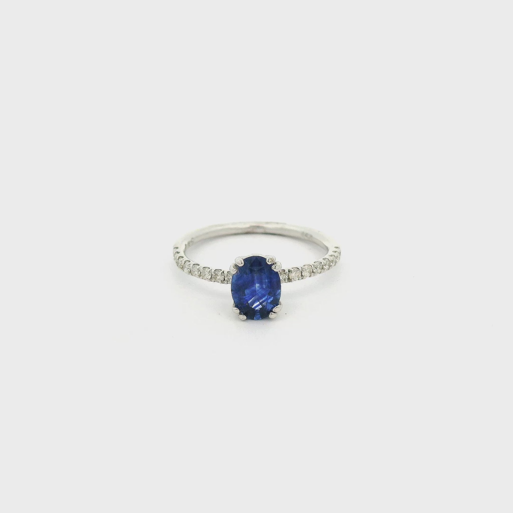 A White Gold Ring with a prong set oval cut natural Sapphire in the center with down the shank at Forever Rox Fine Jewelry, Lake Tahoes Best Jewelry Store
