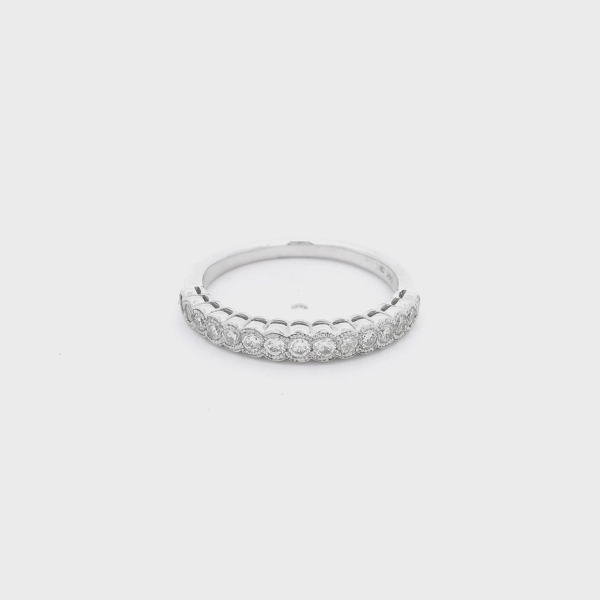White Gold band with diamonds set in milgrain design bezels at Forever Rox Fine Jewelry