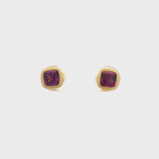 A Pair of Yellow Gold Studs Earrings with bezel set cushion cut natural Purple Garnets in the center at Forever Rox Fine Jewelry, Lake Tahoes Best Jewelry Store