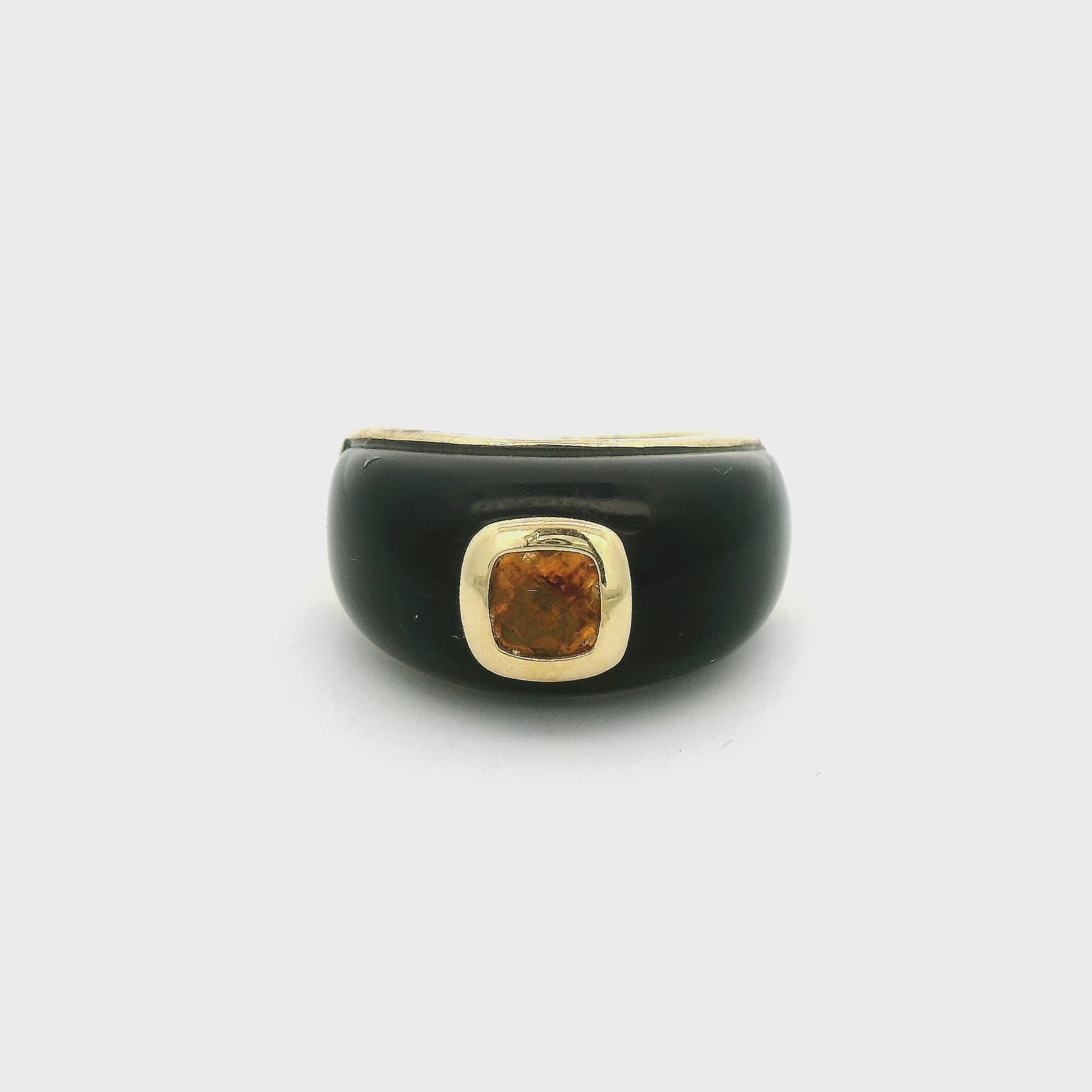 A Yellow Gold Ring with a bezel set cushion cut natural Yellowish Orange Sapphire in the center with onyx around it at Forever Rox Fine Jewelry, Lake Tahoes Best Jewelry Store