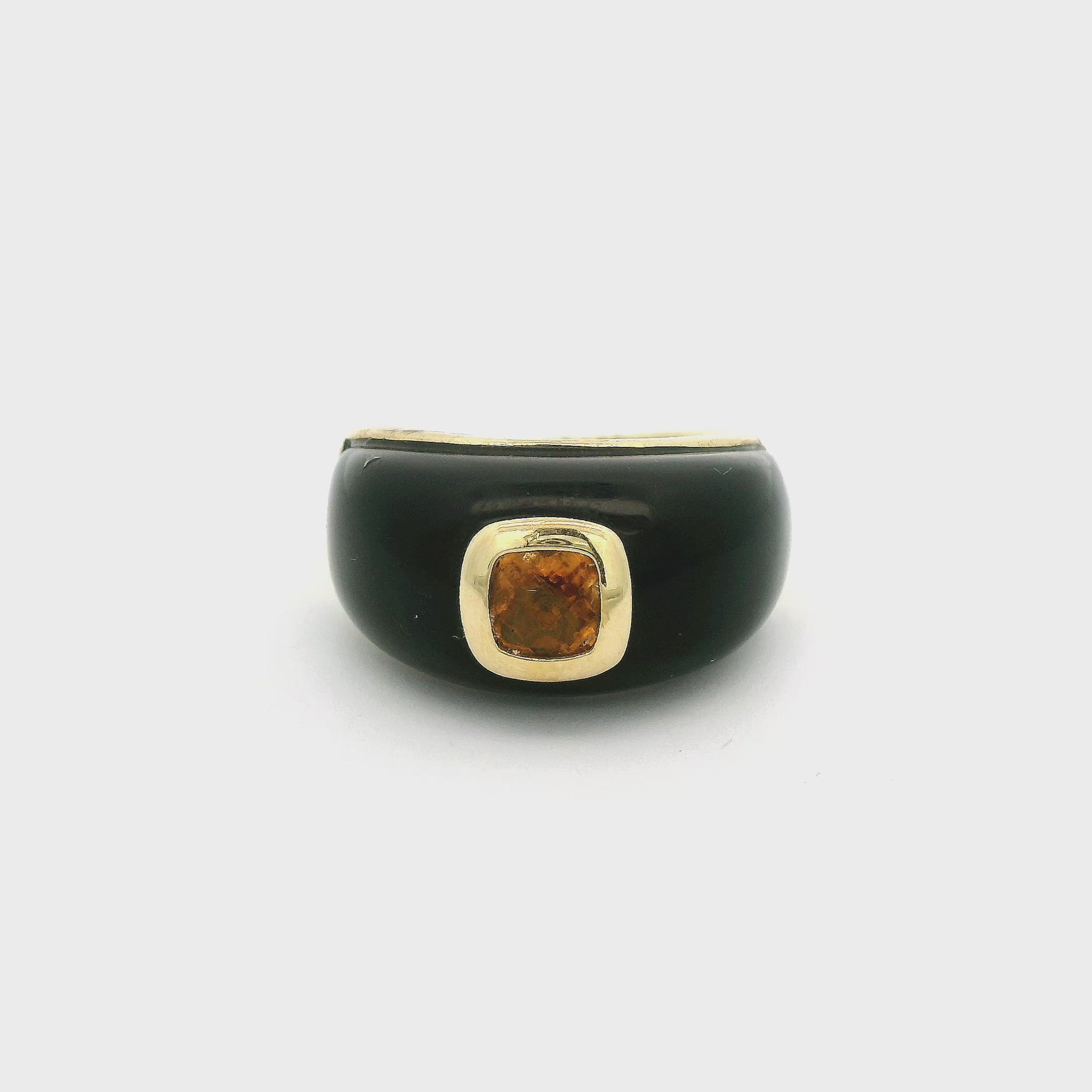 A Yellow Gold Ring with a bezel set cushion cut natural Yellowish Orange Sapphire in the center with onyx around it at Forever Rox Fine Jewelry, Lake Tahoes Best Jewelry Store