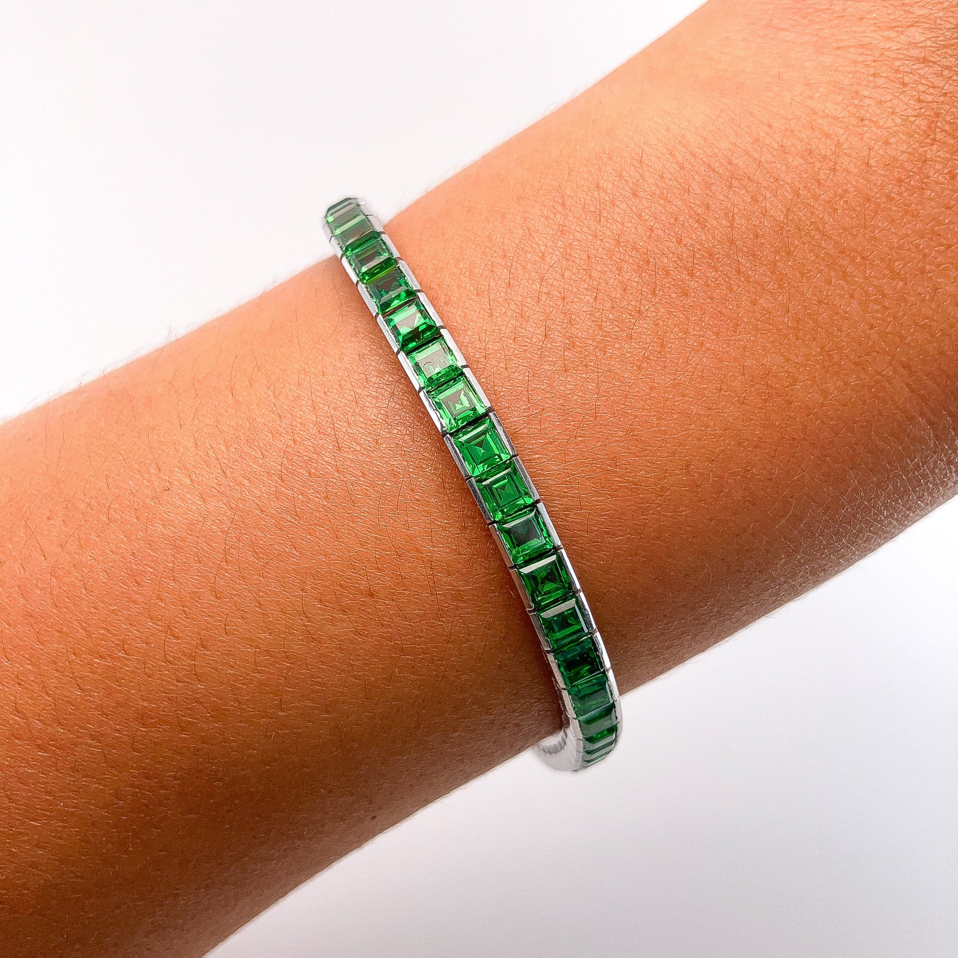 A Platinum Bracelet with square step cut natural Tsavorite Garnets at Forever Rox Fine Jewelry, Lake Tahoes Best Jewelry Store