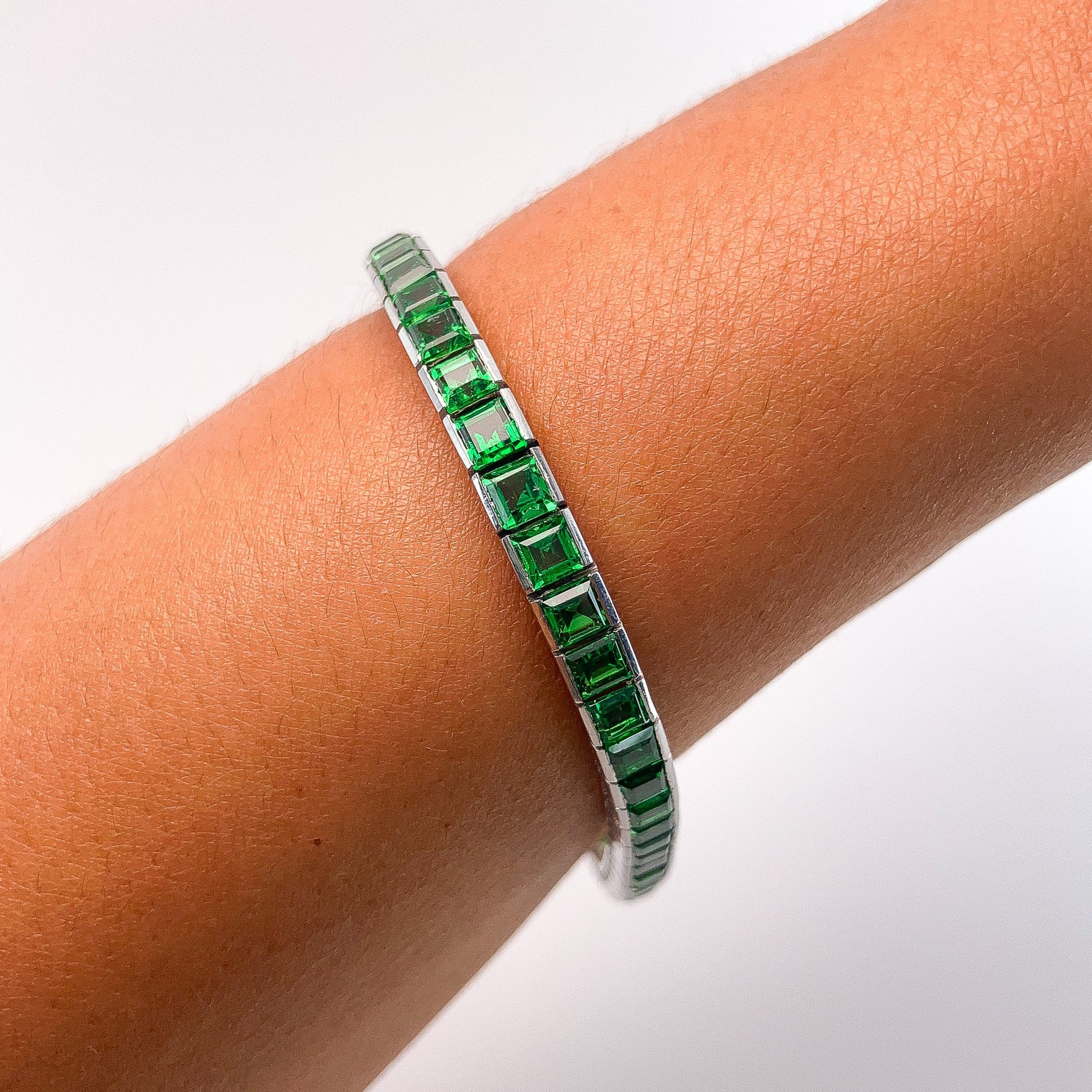 A Platinum Bracelet with square step cut natural Tsavorite Garnets at Forever Rox Fine Jewelry, Lake Tahoes Best Jewelry Store