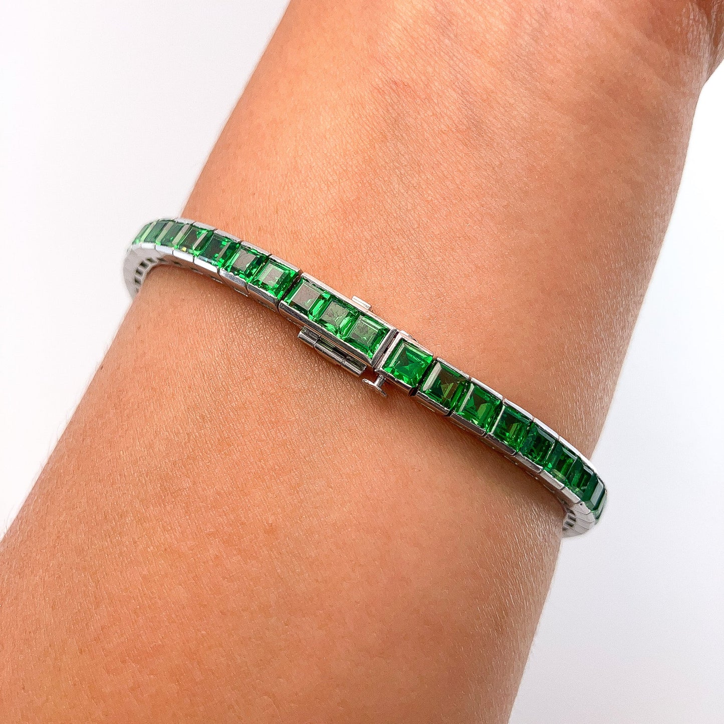 A Platinum Bracelet with square step cut natural Tsavorite Garnets at Forever Rox Fine Jewelry, Lake Tahoes Best Jewelry Store