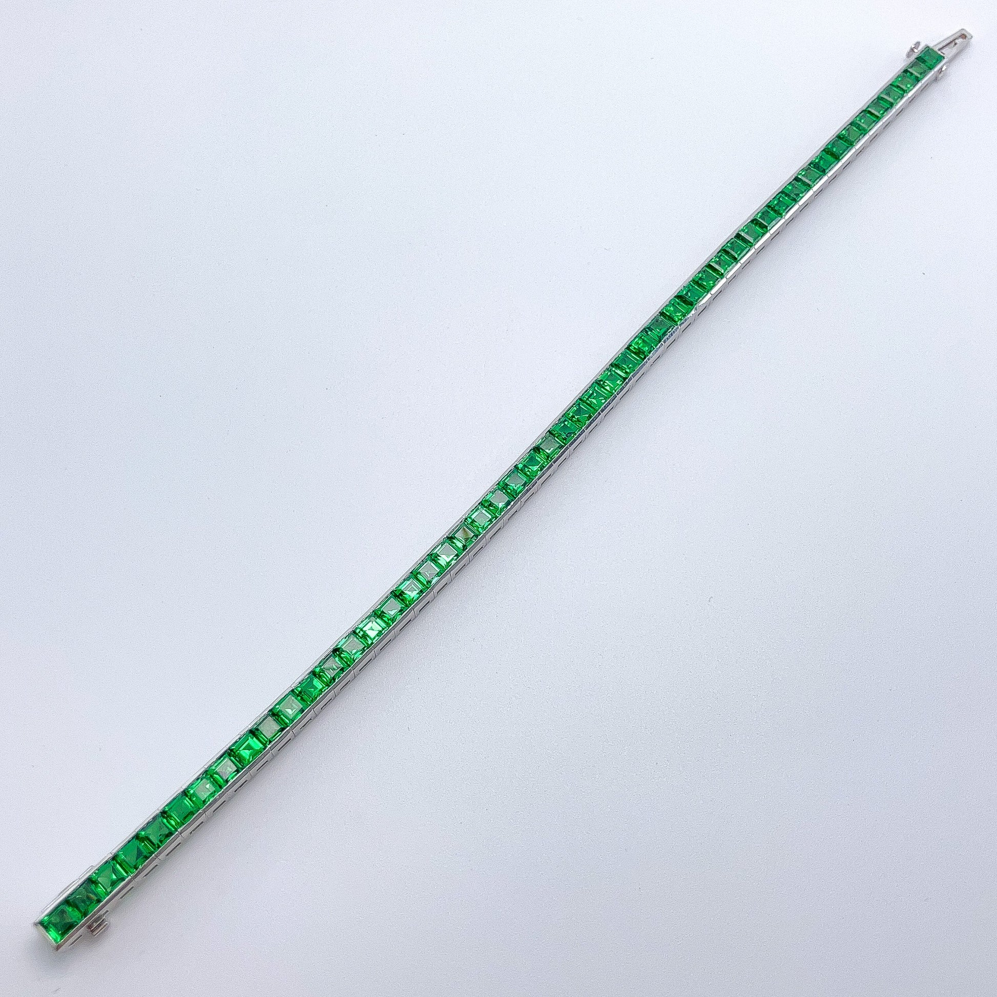 A Platinum Bracelet with square step cut natural Tsavorite Garnets at Forever Rox Fine Jewelry, Lake Tahoes Best Jewelry Store