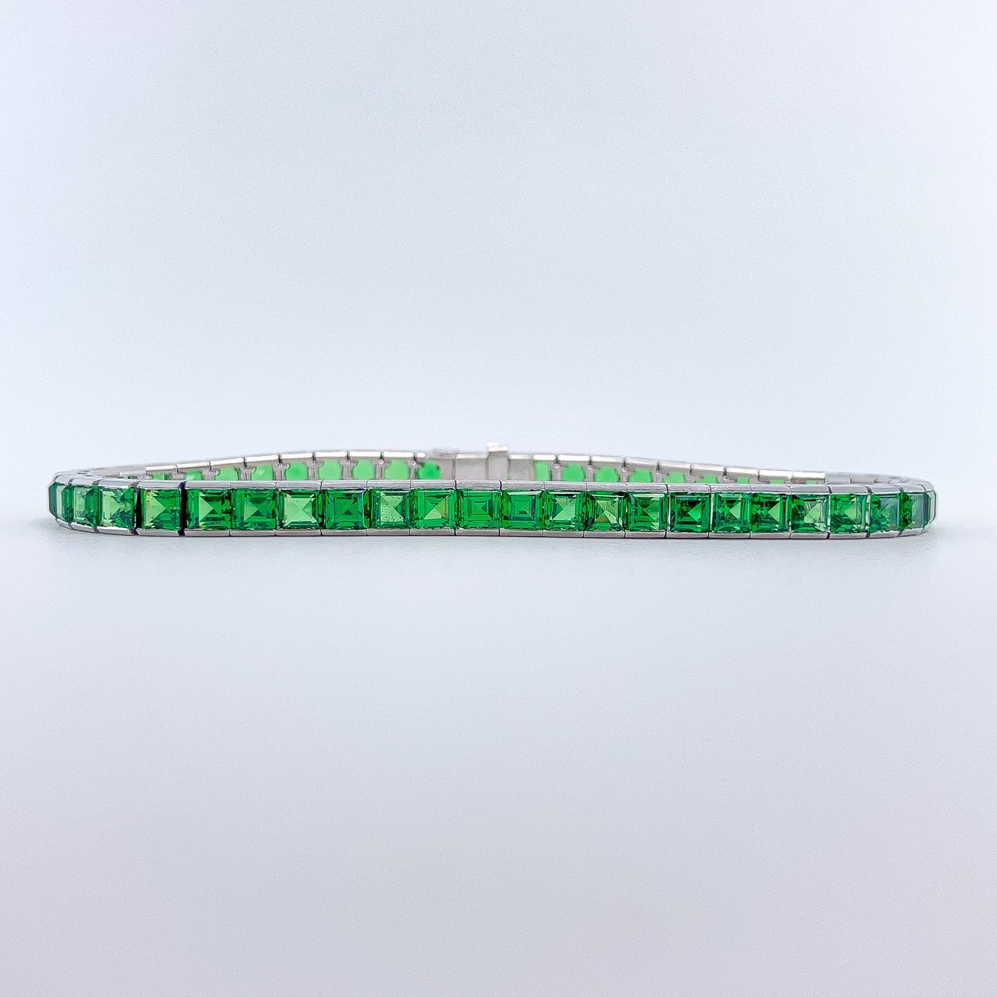 A Platinum Bracelet with square step cut natural Tsavorite Garnets at Forever Rox Fine Jewelry, Lake Tahoes Best Jewelry Store